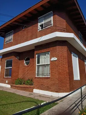 a brick building with windows on the side of it at Brisas del Norte in Villa Carlos Paz