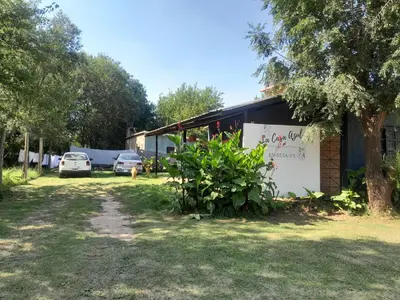 a building with a sign on the side of it at Azul in Villa del Dique