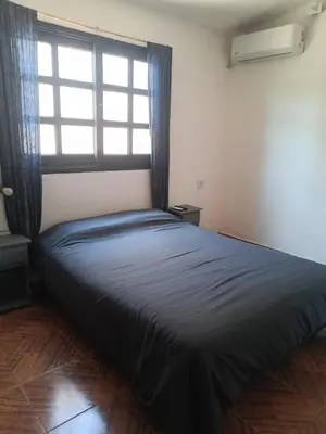 a large bed in a room with a window at Azul in Villa del Dique