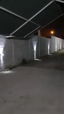 an empty parking lot in a building at night at Departamentos Ecuador in Villa Carlos Paz