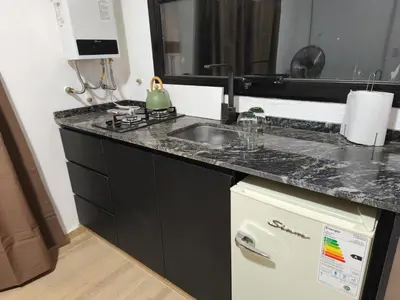 a kitchen with a sink and a counter top at Casasdecampo pasabaxaqui in Villa Anizacate