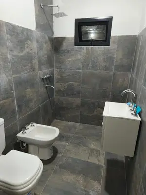 a bathroom with a toilet and a sink at Casasdecampo pasabaxaqui in Villa Anizacate