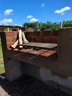a wooden bench sitting on top of a wall at Casasdecampo pasabaxaqui in Villa Anizacate