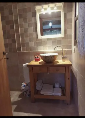 a bathroom with a sink and a mirror at Tenderete in Villa General Belgrano