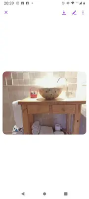 a bathroom sink with a bowl on a table at Tenderete in Villa General Belgrano
