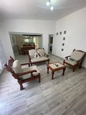 a living room with couches and chairs and a table at Casa Familiar Centrica Abdulle in Villa Cura Brochero
