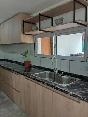 a kitchen with a sink and a window at La Cautivadora, Potrero de Garay in Potrero de Garay