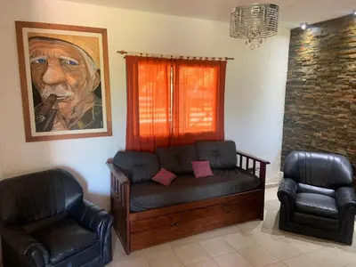 a living room with a couch and two chairs at Casa Isolina in Arroyo de Los Patos