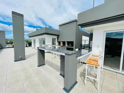 a kitchen on the roof of a house at Veneto VIII in Villa Carlos Paz