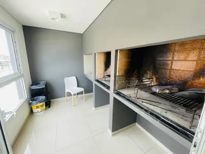 a kitchen with an open oven in a room at Veneto VIII in Villa Carlos Paz