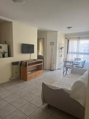 a bedroom with a bed and a tv and a table at Salguero 10 in Cordoba