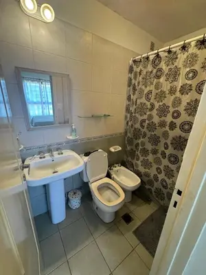 a bathroom with a toilet and a sink at Salguero 10 in Cordoba