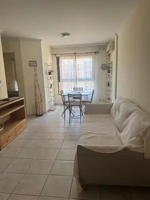 a living room with a bed and a table at Salguero 10 in Cordoba