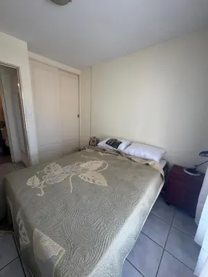 a small bedroom with a bed in the corner at Salguero 10 in Cordoba