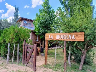 a sign that says la moranza in front of a house at Cabañas La Morena in Panaholma
