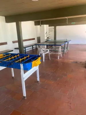 a group of ping pong tables in a room at ALOJATE PREMIUM CARLOS PAZ Oasis in Villa Carlos Paz