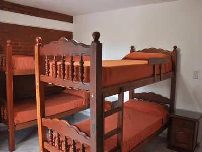 two sets of bunk beds in a room at Cabañas Don Pablo in Mina Clavero