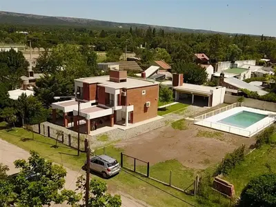an aerial view of a house with a pool at Cabañas Don Pablo in Mina Clavero