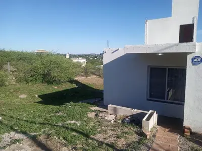 a side view of a building with a window at Mountain View & Comfort in Villa Santa Cruz del Lago