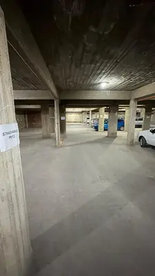 an empty parking garage with cars parked in it at Ailinlduran in Villa Carlos Paz
