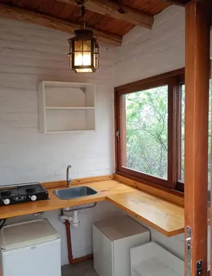 a kitchen with a sink and a window at El paraíso de Tu Descanso in Villa de Las Rosas