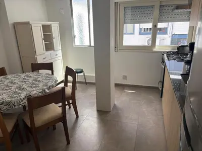 a kitchen and dining room with a table and a table and chairs at Departamento amplio para 6 personas Zona Centro in Cordoba