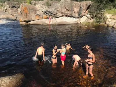 a group of people standing in the water at Sauron Adventure in Cuesta Blanca