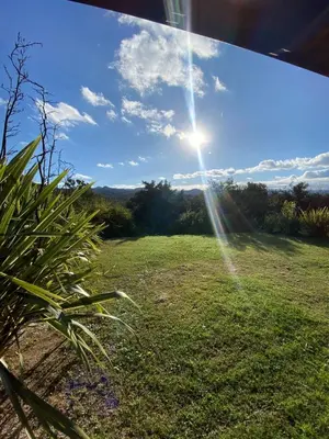 a view of a field with the sun in the sky at Altos de ensueños in Alpa Corral