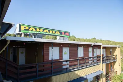 a building with a sign on top of it at Parada 14 in Cavalango