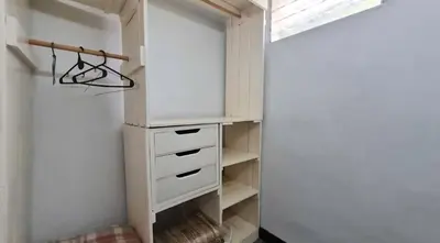 a walk in closet with a dresser and a window at Departamento Villa Carlos Paz Excelente Ubicación in Villa Carlos Paz