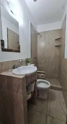 a bathroom with a sink and a toilet at Departamento Villa Carlos Paz Excelente Ubicación in Villa Carlos Paz