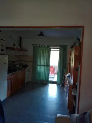 a kitchen with a door open to a patio at La Serranita de Miguel in Villa Serranita