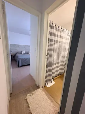 a room with a view of a bedroom at Nuevocentro Apartment in Cordoba