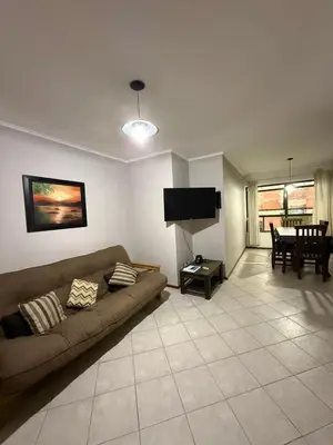 a living room with a couch and a table at Departamento alquiler temporal Nueva Cordoba in Cordoba