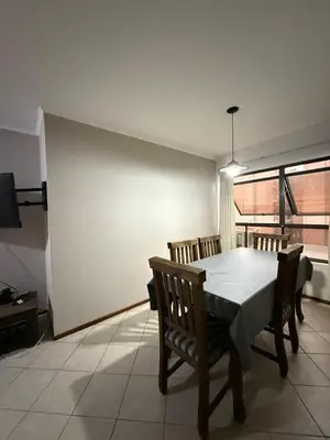 a dining room with a table and chairs and a window at Departamento alquiler temporal Nueva Cordoba in Cordoba