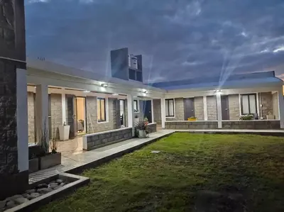 a house with a lawn in front of it at Sierras y Volcanes in Taninga