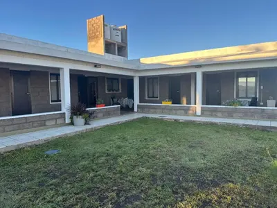 a house with a lawn in front of it at Sierras y Volcanes in Taninga