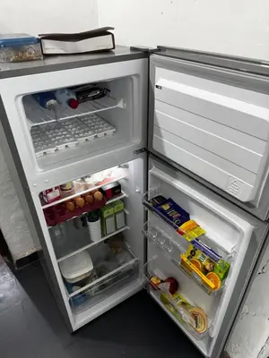 an open refrigerator with its door open and food inside at Casa pleno centro Villa Dolores in Villa Dolores