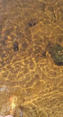 a close up of water with rocks in it at Casa- alojamiento Gerez in San Antonio de Arredondo