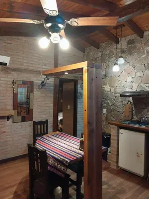 a dining room with a table and a ceiling fan at soy ahora in San Javier