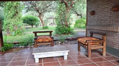 two chairs and a bench on a patio at soy ahora in San Javier