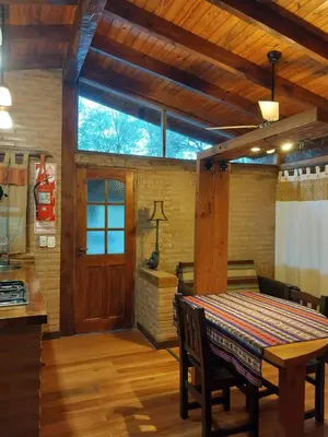 a dining room with a table and a large window at soy ahora in San Javier