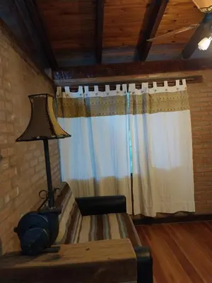 a living room with a table and a lamp at soy ahora in San Javier