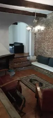a living room with a couch and a table at Casa Mudita in Cordoba