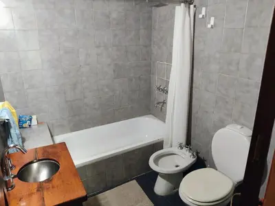 a bathroom with a toilet and a tub and a sink at Casa Mudita in Cordoba