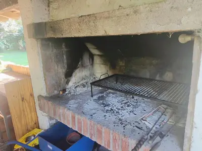 a brick oven with a fire inside of it at Casa Mudita in Cordoba