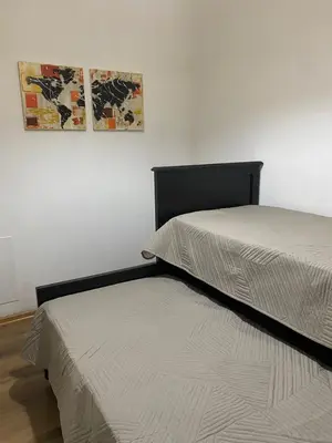 two beds sitting next to each other in a room at San Plácido in Bialet Massé