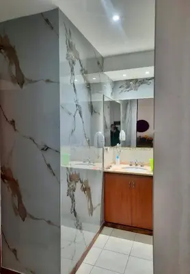 a bathroom with a sink and a mirror at Edificio Panorámico in Villa Carlos Paz