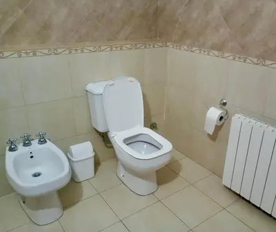 a bathroom with a toilet and a bidet at Edificio Panorámico in Villa Carlos Paz