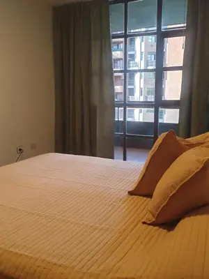a bedroom with a large bed with a window at Cómodo departamento en Nueva Córdoba in Cordoba